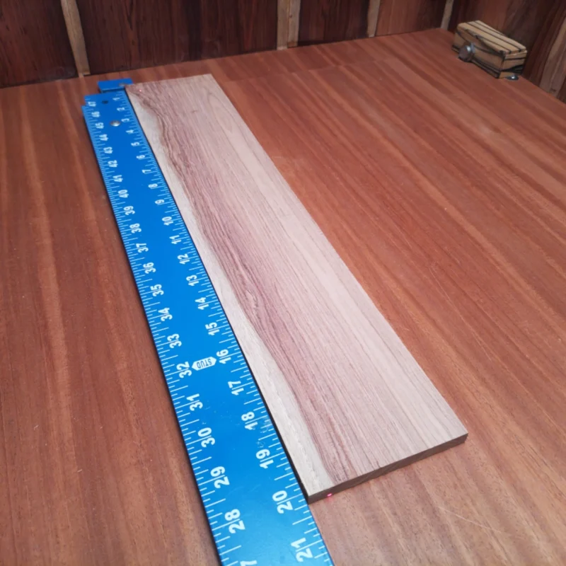 Honduran Rosewood Acoustic Rift Sawn Fingerboard Blank 0.4" X 4.0" X 20.0" - HRAFBR000120 3 Elevate your luthiery game with this Honduran Rosewood fingerboard blank, perfect for crafting high-quality acoustic instruments. Its rift-sawn grain offers unparalleled stability and striking aesthetics, ensuring a refined touch to any guitar. Gaining popularity in the luthier community, this material promises to enhance tone and playability, making it an essential addition to your workshop. Create your masterpiece with a wood that harmonizes beauty and functionality! It is a Honduran Rosewood Acoustic Rift Sawn fingerboard blank with dimensions of 20.0 x 4.0 x 0.4 inches.