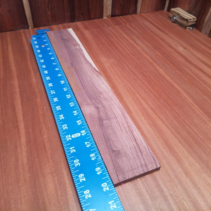 Honduran Rosewood Acoustic Rift Sawn Fingerboard Blank 0.4" X 3.0" X 20.0" - HRAFBR000121 3 Elevate your next acoustic project with this premium rift-sawn Honduran Rosewood blank. Perfect for luthiers seeking rich, resonant tonal qualities, this wood offers stunning visuals and superior workability. Its unique grain patterns and density contribute to a warm, focused sound that will enhance any instrument. Don't miss out on this fantastic addition to your workshop – a fine choice for serious builders and hobbyists alike! It is a Honduran Rosewood Acoustic Rift Sawn fingerboard blank with dimensions of 20.0 x 3.0 x 0.4 inches.
