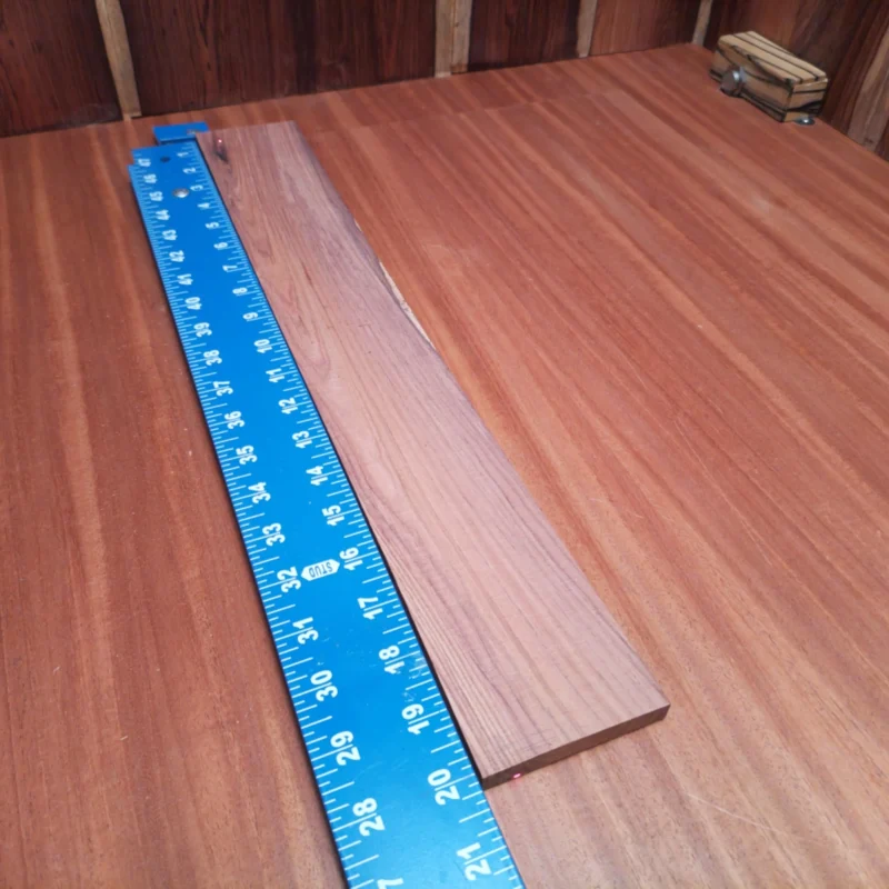 Unlock your creativity with this Honduran Rosewood blank, ideal for luthiers crafting stunning acoustic instruments. Boasting superb tonal qualities, its rift sawn cut maximizes stability and resonance. Perfect for elegant guitar necks or fretboards, this premium wood ages beautifully over time, enhancing your instruments' sound. Get ready to elevate your craft with this beautiful blank! It is a Honduran Rosewood Acoustic Rift Sawn fingerboard blank with dimensions of 20.0 x 2.7 x 0.4 inches.
