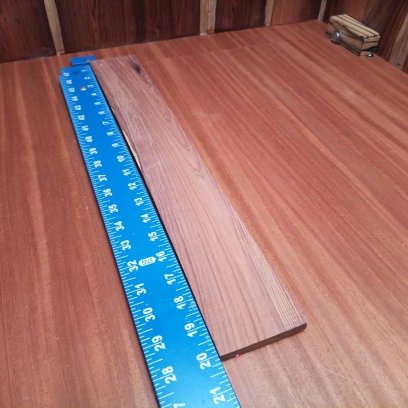 Get ready to elevate your next acoustic project with this Honduran Rosewood blank. Its stunning rift sawn character lends a unique resonance and rich tonal quality, perfect for luthiers seeking to create instruments that not only sound beautiful but also resonate with a timeless appeal. Whether you're crafting a guitar or a ukulele, this exquisite wood ensures durability and style in every build. It is a Honduran Rosewood Acoustic Rift Sawn fingerboard blank with dimensions of 20.0 x 2.9 x 0.4 inches.