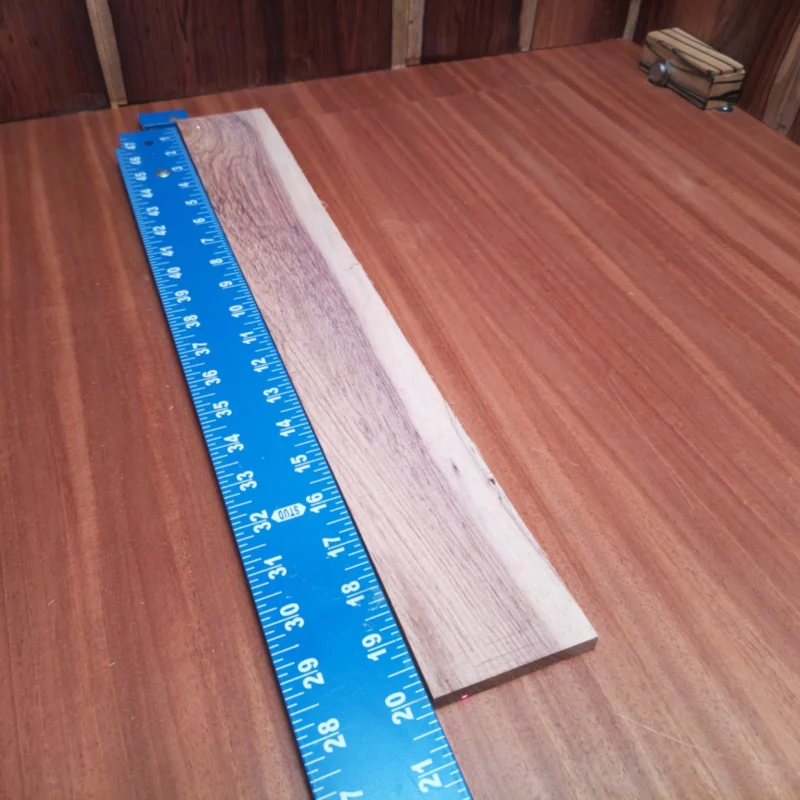 Honduran Rosewood Acoustic Rift Sawn Fingerboard Blank 0.4" X 2.8" X 20.0" - HRAFBR000129 3 Elevate your craft with this Honduran Rosewood fingerboard blank, perfect for luthiers! Its unique beauty offers deep, rich tones, while the rift sawn cuts ensure superior stability. Ready for shaping into your next masterpiece, this blank is destined to impress both players and builders alike. Get ready to create the ultimate acoustic experience, combining elegance with performance. It is a Honduran Rosewood Acoustic Rift Sawn fingerboard blank with dimensions of 20.0 x 2.8 x 0.4 inches.