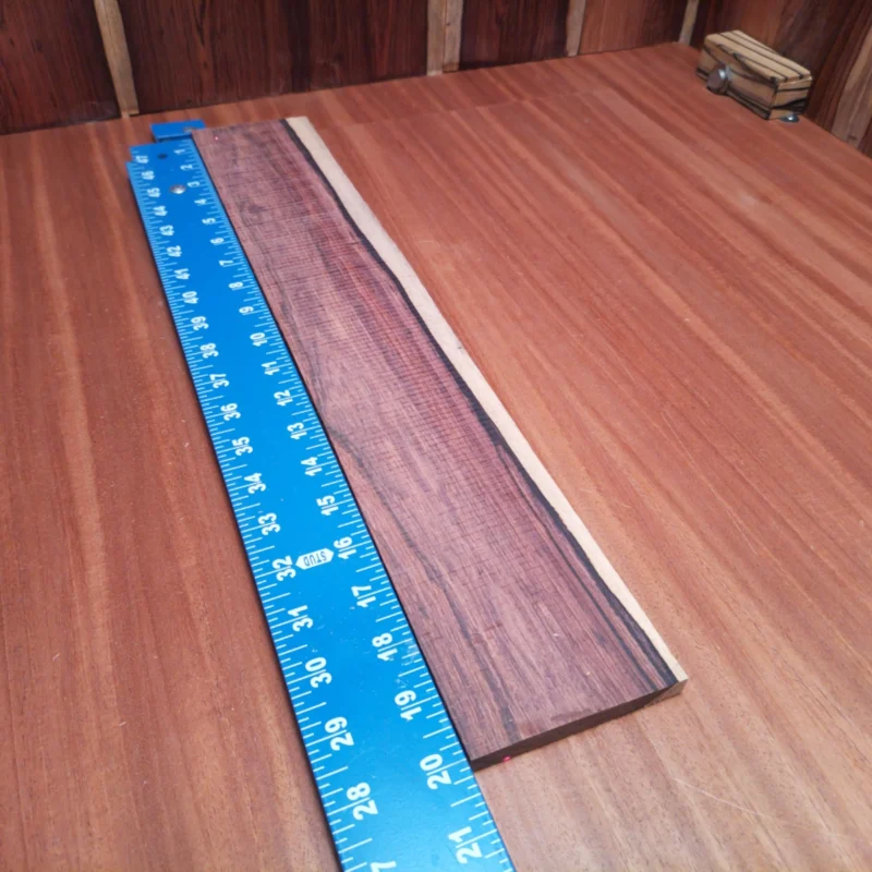 Unlock the full potential of your musical creations with our premium Honduran Rosewood blank. This stunning acoustic wood offers rich tonal qualities and a beautiful aesthetic that will elevate any luthier's instrument. Perfect for crafting guitars, ukuleles, or custom projects, you'll appreciate the deep resonance and vibrant sound. Experience the harmonious blend of tradition and quality in your next build! It is a Honduran Rosewood Acoustic Rift Sawn fingerboard blank with dimensions of 20.0 x 3.4 x 0.4 inches.