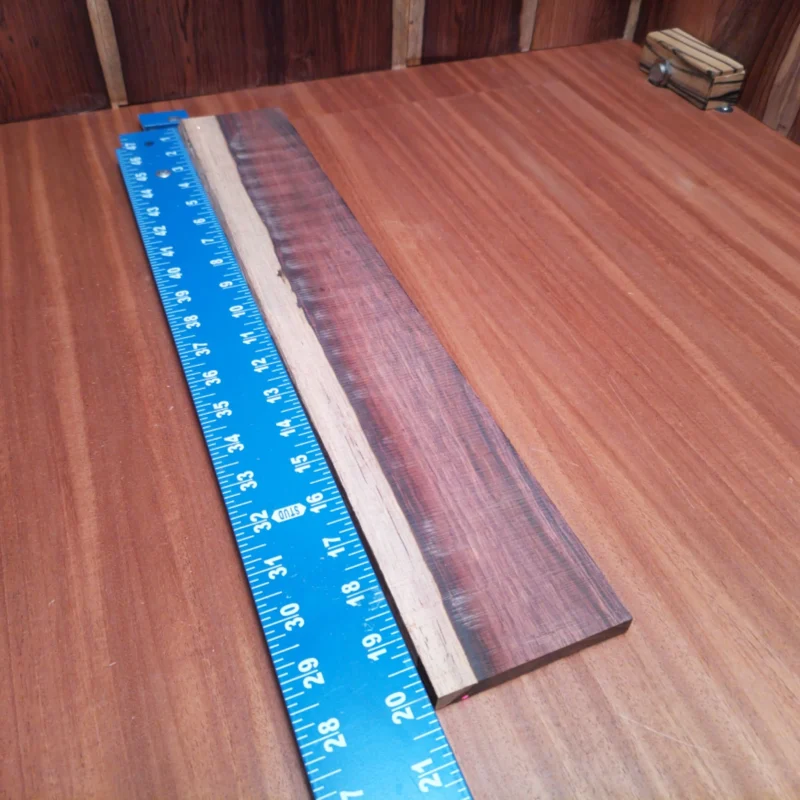 Unlock the full potential of your musical creations with our premium Honduran Rosewood blank. This stunning acoustic wood offers rich tonal qualities and a beautiful aesthetic that will elevate any luthier's instrument. Perfect for crafting guitars, ukuleles, or custom projects, you'll appreciate the deep resonance and vibrant sound. Experience the harmonious blend of tradition and quality in your next build! It is a Honduran Rosewood Acoustic Rift Sawn fingerboard blank with dimensions of 20.0 x 3.4 x 0.4 inches.