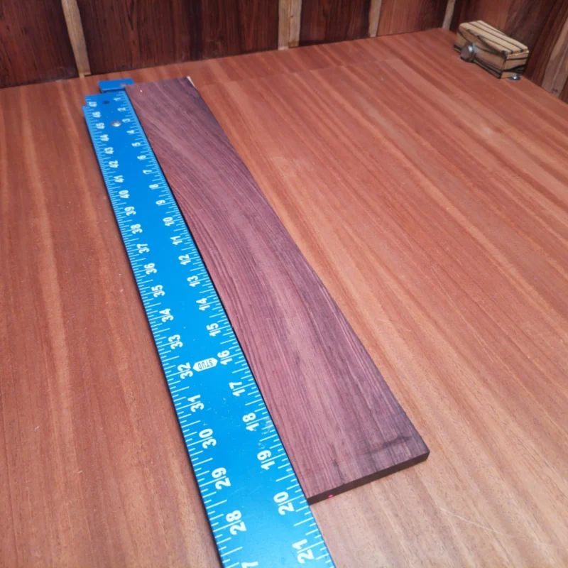 Honduran Rosewood Acoustic Rift Sawn Fingerboard Blank 0.4" X 2.8" X 20.0" - HRAFBR000135 3 Crafted from premium Honduran rosewood, this fingerboard blank is perfect for luthiers seeking quality and versatility. Its rich tonal properties enhance any acoustic instrument, while the rift sawn grain pattern adds stunning visual appeal. Ideal for creating exceptional fingerboards, this blank combines beauty with functionality, ensuring a smooth playing experience. Elevate your instrument projects with this high-quality blank that musicians will love and admire! It is a Honduran Rosewood Acoustic Rift Sawn fingerboard blank with dimensions of 20.0 x 2.8 x 0.4 inches.