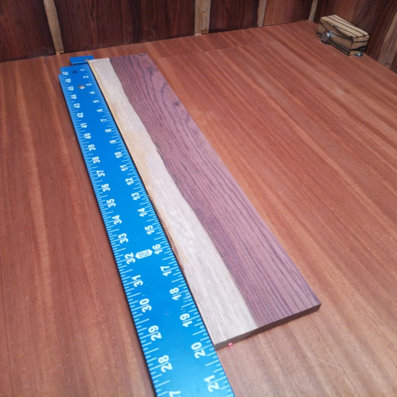 Honduran Rosewood Acoustic Rift Sawn Fingerboard Blank 0.4" X 3.8" X 20.0" - HRAFBR000139 3 Unlock the potential of your next build with this Honduran Rosewood blank. Known for its rich tone and beautiful grain, this rift sawn piece offers luthiers the ideal blend of aesthetic appeal and acoustic quality. Perfect for crafting backs, sides, or fretboards, it will elevate your instrument to professional standards while delivering excellent resonance. Don’t miss the chance to incorporate this stunning wood into your masterwork! It is a Honduran Rosewood Acoustic Rift Sawn fingerboard blank with dimensions of 20.0 x 3.8 x 0.4 inches.