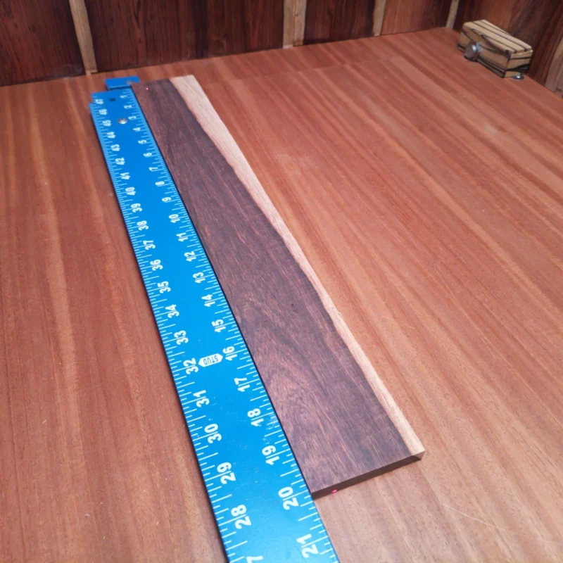 Transform your acoustic projects with this Honduran Rosewood blank, perfect for luthiers seeking rich tones. Its stunning grain adds both beauty and depth, ensuring every strum resonates with vibrant sound quality. Crafted with precision, it's ideal for crafting warm, inviting acoustics that stand out. Elevate your creations with a material that combines aesthetics and performance seamlessly, making every instrument a work of art and a joy to play. It is a Honduran Rosewood Acoustic Rift Sawn fingerboard blank with dimensions of 20.0 x 2.8 x 0.4 inches.