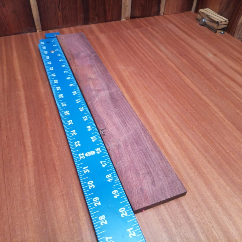 Transform your builds with this premium Honduran Rosewood blank. Its unique rift sawn cut ensures remarkable tonal qualities, rich character, and stunning aesthetics for your acoustic instruments. Ideal for luthiers seeking the perfect balance of beauty and functionality, this blank promises to elevate your craft. Get ready to impress both the eyes and ears with your next creation! It is a Honduran Rosewood Acoustic Rift Sawn fingerboard blank with dimensions of 20.1 x 2.8 x 0.3 inches.