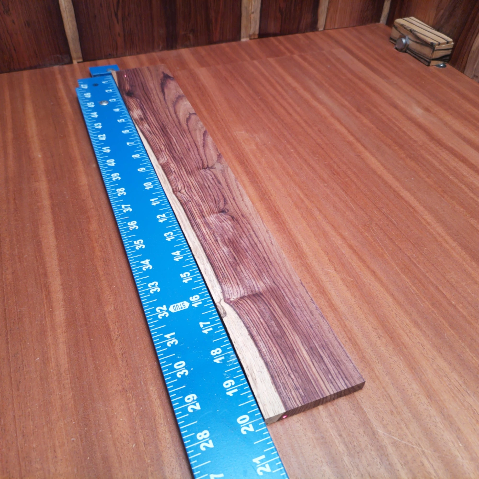 Honduran Rosewood Acoustic Rift Sawn Fingerboard Blank 0.4" X 2.8" X 20.0" - HRAFBR000152 1 Unleash your creativity with this premium Honduran Rosewood blank! Perfectly crafted for luthiers, it promises a robust tone and striking aesthetics. This fingerboard blank delivers excellent resonance and playability, ensuring a fantastic playing experience. Whether you’re crafting or customizing, this versatile wood is your perfect partner for stunning instruments that will stand out on any stage. It is a Honduran Rosewood Acoustic Rift Sawn fingerboard blank with dimensions of 20.0 x 2.8 x 0.4 inches.
