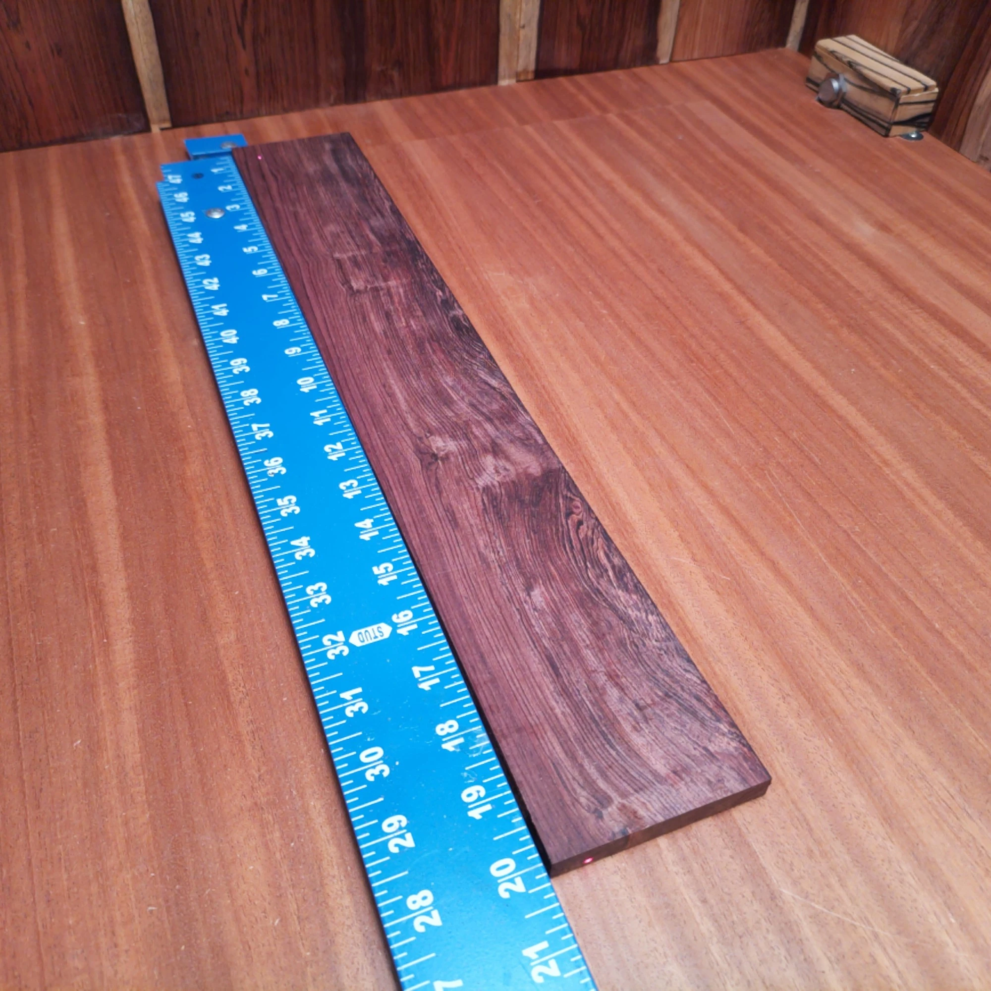 Honduran Rosewood Acoustic Rift Sawn Fingerboard Blank 0.4" X 3.0" X 20.0" - HRAFBR000153 1 Unleash your creativity with this premium Honduran Rosewood acoustic fingerboard blank. Its rich tonal quality and beautiful grain elevate your lutherie projects, making it the perfect choice for building exceptional instruments. Whether crafting a guitar or a ukulele, this blank combines durability with a stunning look, ensuring your instrument will stand out. Transform your musical vision into reality with this must-have fingerboard addition! It is a Honduran Rosewood Acoustic Rift Sawn fingerboard blank with dimensions of 20.0 x 3.0 x 0.4 inches.