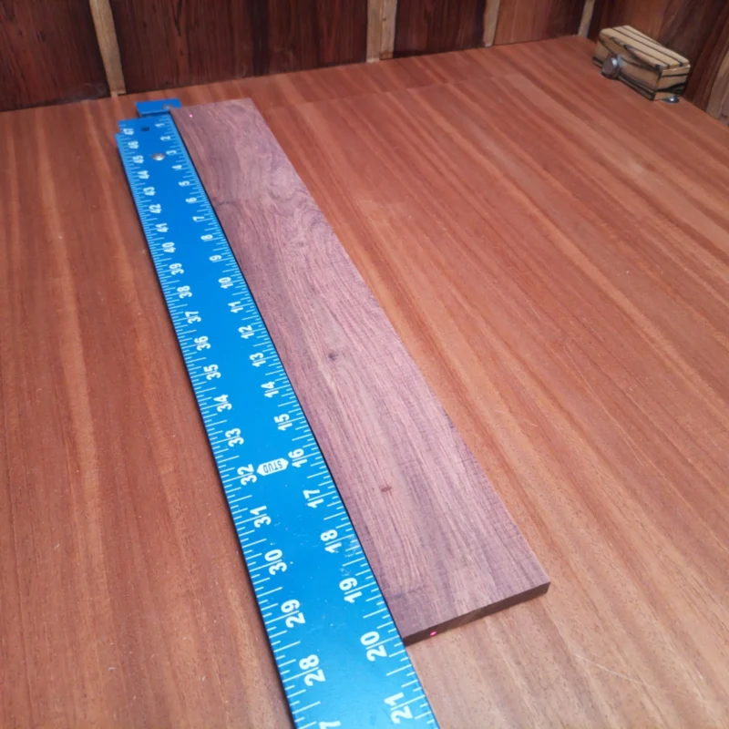 Fingerboard Blanks 142 Unlock your creativity with this Honduran Rosewood fingerboard blank. Perfect for luthiers, it boasts a beautiful grain and resonant properties. Measuring 0.4" X 2.8" X 20.0", this fingerboard offers ample space for crafting stunning musical instruments. Whether you’re making a guitar or a ukulele, this unique wood will elevate your project to new heights. Get ready to impress with a piece that’s as striking as it is functional! It is a Honduran Rosewood Acoustic Rift Sawn fingerboard blank with dimensions of 20.0 x 2.8 x 0.4 inches.
