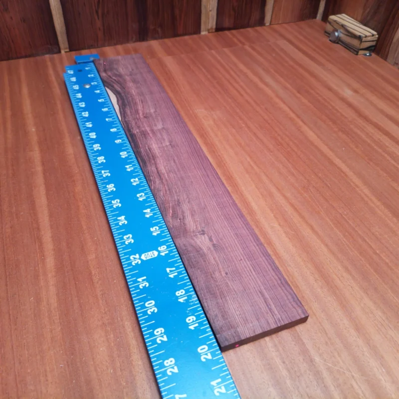 Honduran Rosewood Acoustic Rift Sawn Fingerboard Blank 0.4" X 3.0" X 20.0" - HRAFBR000157 3 Unleash your creativity with this stunning Honduran Rosewood blank, ideal for luthiers! Its smooth finish and uniform grain ensure that every acoustic instrument will resonate beautifully. Perfect for building guitars, ukuleles, or any custom project, this blank provides excellent tonal quality and durability, guaranteeing a truly unique sound. Don't miss out on the chance to elevate your craft with this premium rosewood blank! It is a Honduran Rosewood Acoustic Rift Sawn fingerboard blank with dimensions of 20.0 x 3.0 x 0.4 inches.