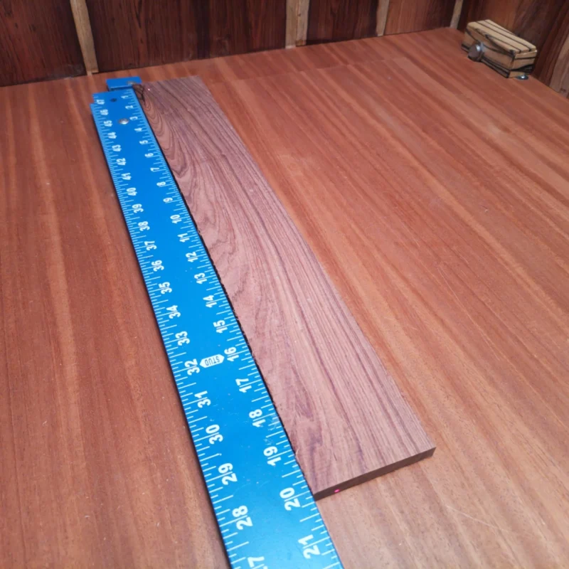 Fingerboard Blanks 44 Unlock your creative potential with this Honduran Rosewood blank, perfect for luthiers. Crafted from premium rift sawn wood, it provides remarkable tonal qualities and beautiful aesthetics for your next acoustic masterpiece. The durable structure enhances resonance and projection, making it ideal for inspired sound and captivating design. Elevate your craft with this stunning fingerboards blank! It is a Honduran Rosewood Acoustic Rift Sawn fingerboard blank with dimensions of 20.1 x 3.0 x 0.3 inches.