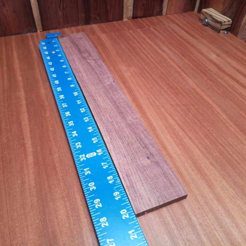 Honduran Rosewood Acoustic Rift Sawn Fingerboard Blank 0.4" X 2.9" X 20.2" - HRAFBR000163 3 Get ready to elevate your acoustic projects with this premium Honduran Rosewood blank. Known for its rich tonal qualities, it's perfect for luthiers seeking vibrant sound and stunning aesthetics. This versatile wood boasts tight grain and incredible durability, ensuring your instruments will impress both visually and acoustically. A reliable choice for creating your next masterpiece! It is a Honduran Rosewood Acoustic Rift Sawn fingerboard blank with dimensions of 20.2 x 2.9 x 0.4 inches.