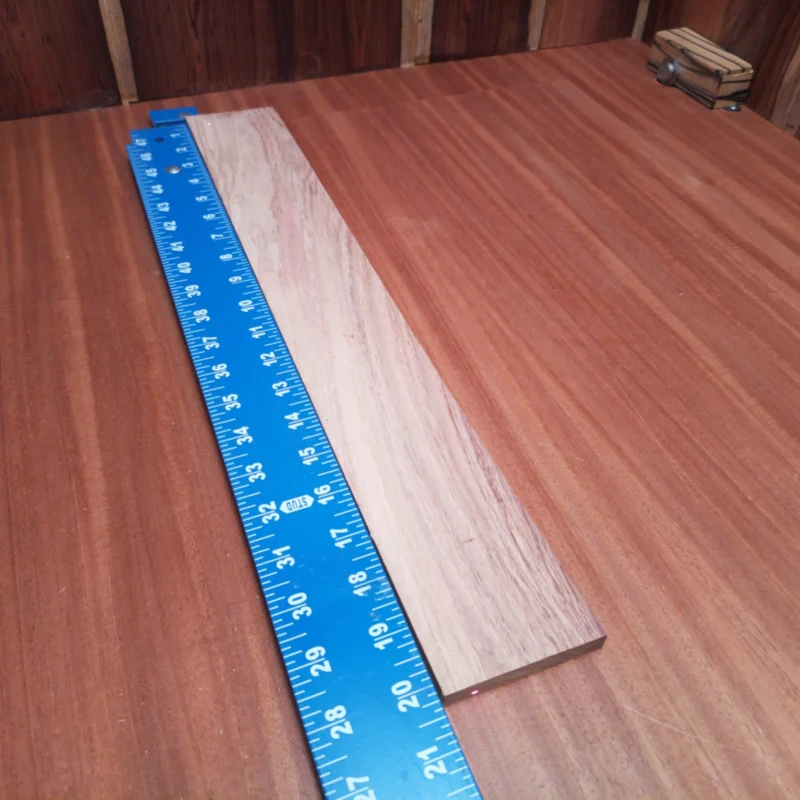 Honduran Rosewood Acoustic Rift Sawn Fingerboard Blank 0.4" X 2.8" X 20.2" - HRAFBR000164 3 Crafted from premium Honduran Rosewood, this fingerboard blank delivers an unbeatable combination of stability and tonal richness. Ideal for luthiers aiming to create stunning acoustic guitars, its rift-sawn grain ensures a beautiful finish and long-lasting durability. Elevate your craftsmanship with this versatile tool that enhances playability and resonance, making it a perfect addition to your workshop. It is a Honduran Rosewood Acoustic Rift Sawn fingerboard blank with dimensions of 20.2 x 2.8 x 0.4 inches.
