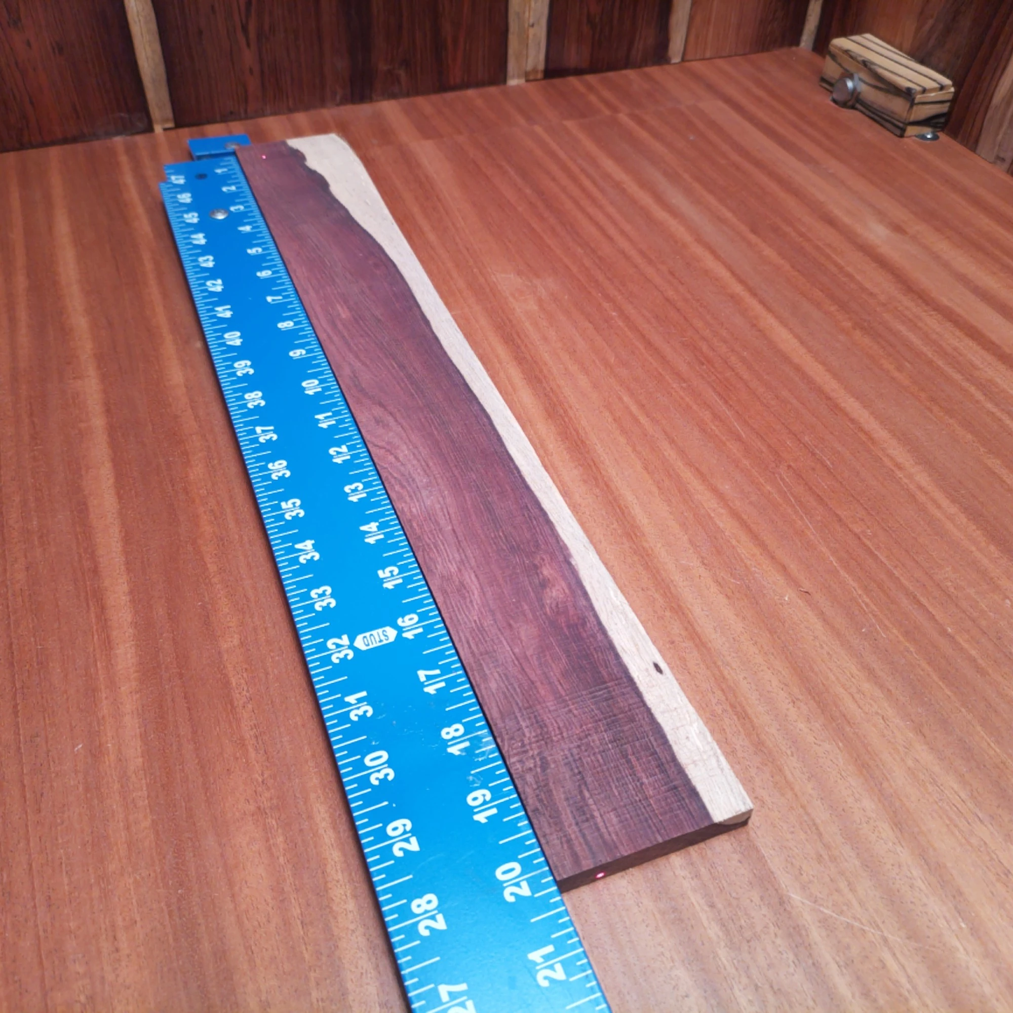 Honduran Rosewood Acoustic Rift Sawn Fingerboard Blank 0.4" X 2.8" X 20.2" - HRAFBR000165 2 Elevate your crafting with this Honduran Rosewood Acoustic blank. With its rift-sawn design, this wood showcases stunning grain patterns and rich tonal character. Perfect for luthiers seeking durability and a warm, resonant sound in their acoustic builds. Get ready to turn heads and ears with your next project using this beautiful, versatile wood. It is a Honduran Rosewood Acoustic Rift Sawn fingerboard blank with dimensions of 20.2 x 2.8 x 0.4 inches.