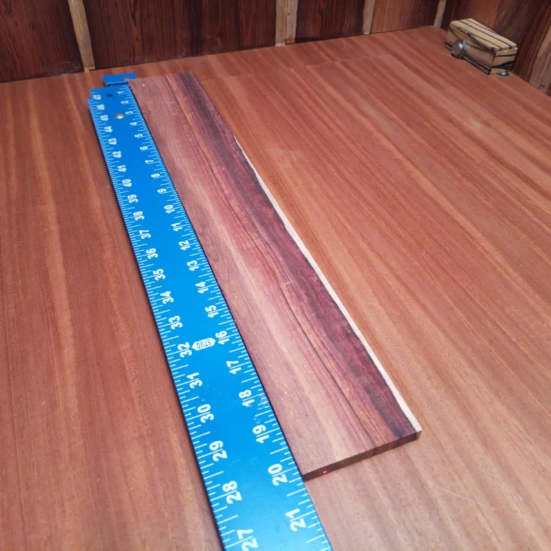 Elevate your luthier projects with this Honduran Rosewood blank. Boasting a stunning grain pattern and rich tonal qualities, this acoustic wood is perfect for crafting beautiful instruments. The rift sawn cut brings out the wood's natural beauty, making it a favorite among builders looking to create standout guitars. With its durable composition, this blank is ready for all your fretting and sound projects! It is a Honduran Rosewood Acoustic Rift Sawn fingerboard blank with dimensions of 20.3 x 3.0 x 0.4 inches.