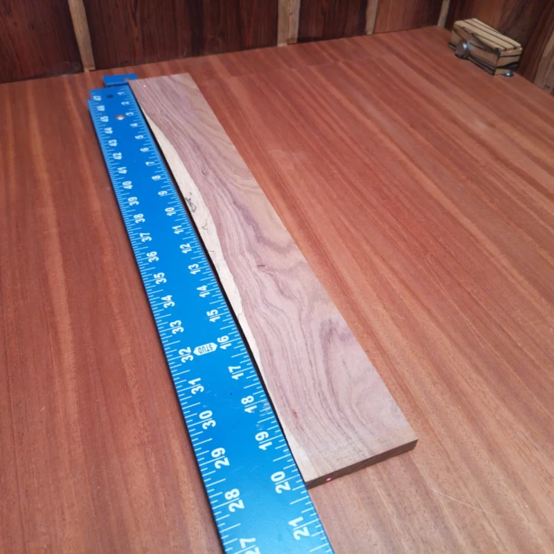 Crafted from premium Honduran Rosewood, this fingerboard blank promises rich tonal qualities and stunning aesthetics. Perfectly suitable for luthiers, it provides a stable, durable surface that enhances playability. Whether you're building a guitar or ukulele, you'll appreciate this exceptional blank's workability and responsiveness. Elevate your next project with this beautiful rift sawn piece that exemplifies quality craftsmanship. It is a Honduran Rosewood Acoustic Rift Sawn fingerboard blank with dimensions of 20.2 x 2.8 x 0.4 inches.