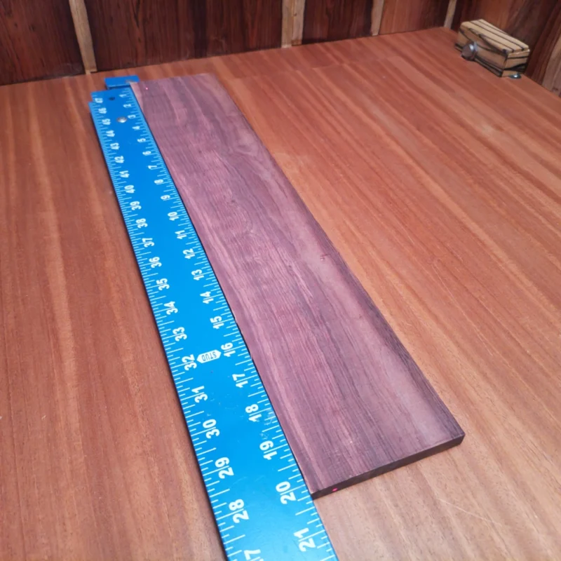 Honduran Rosewood Acoustic Rift Sawn Fingerboard Blank 0.3" X 3.8" X 20.1" - HRAFBR000182 3 Crafted specially for luthiers, this Honduran Rosewood blank is your key to vibrant acoustic guitars. With its stunning rift sawn grain, it offers both beauty and strength. This high-quality wood helps deliver rich tonal depth and bright resonance for professional-grade sound. Whether you’re a seasoned pro or a hobbyist, this fingerboards blank is perfect for your next musical masterpiece. It is a Honduran Rosewood Acoustic Rift Sawn fingerboard blank with dimensions of 20.1 x 3.8 x 0.3 inches.