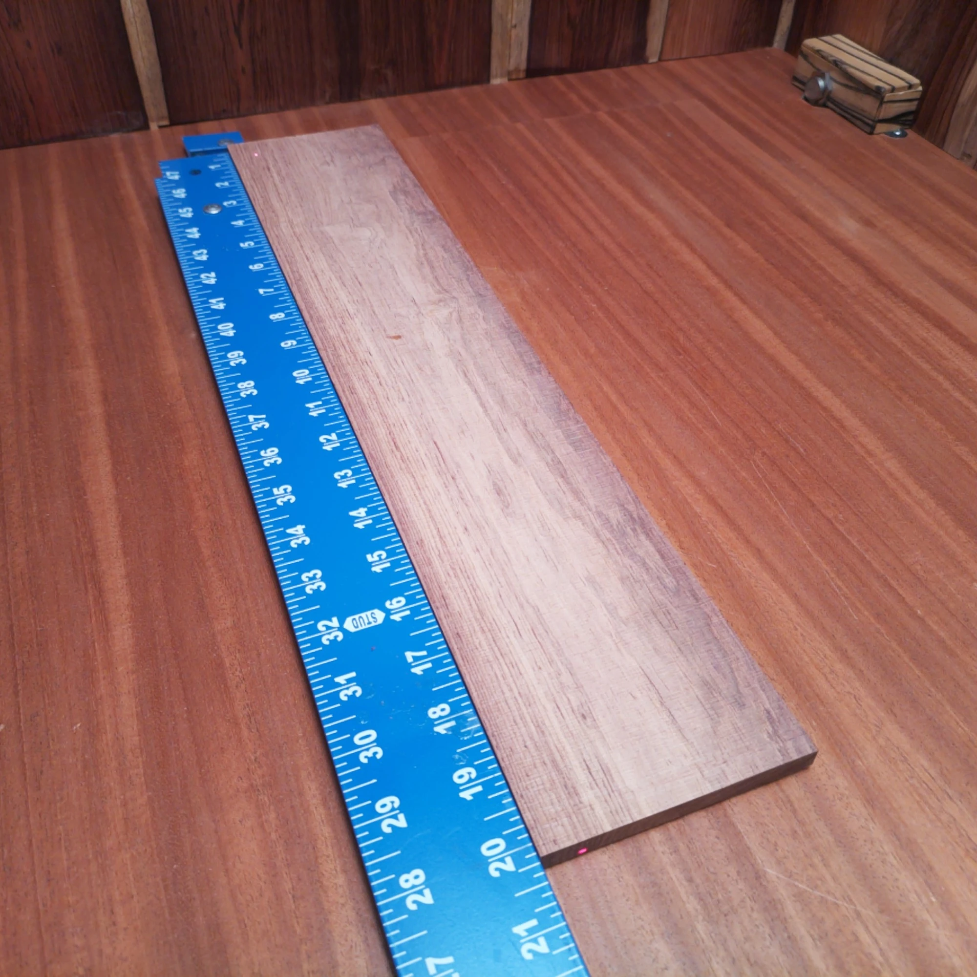 Honduran Rosewood Acoustic Rift Sawn Fingerboard Blank 0.3" X 4.0" X 20.1" - HRAFBR000184 1 Unlock the potential of your next build with this Honduran Rosewood fingerboard blank! Perfect for luthiers, this top-quality, rift sawn piece delivers excellent tonal qualities, unparalleled durability, and stunning aesthetics. Ideal for acoustic guitars, this blank promises to elevate your craftsmanship to new heights. Say goodbye to ordinary and embrace extraordinary with this must-have tonewood in your workshop! It is a Honduran Rosewood Acoustic Rift Sawn fingerboard blank with dimensions of 20.1 x 4.0 x 0.3 inches.