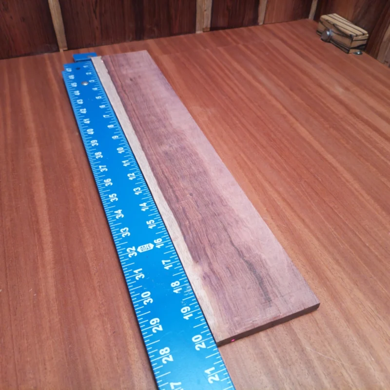Enhance your acoustic guitars with this premium Honduran Rosewood blank, ideal for luthiers. Measuring 0.4" x 3.7" x 20.2", this rift sawn wood offers exceptional tonal qualities and stunning aesthetics. Perfect for high-quality fingerboards, it brings a touch of elegance while ensuring durability and playability. Fine-tune your craft and create instruments that resonate beautifully, thanks to the unique properties of this sought-after hardwood. It is a Honduran Rosewood Acoustic Rift Sawn fingerboard blank with dimensions of 20.2 x 3.7 x 0.4 inches.