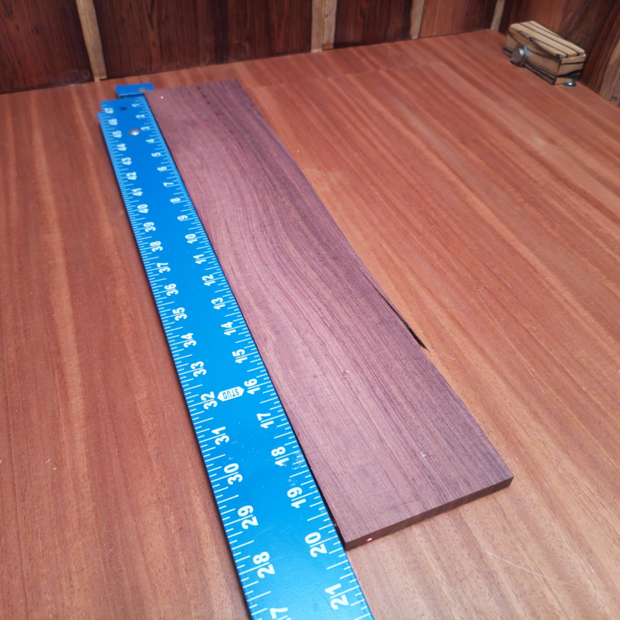 Honduran Rosewood Acoustic Rift Sawn Fingerboard Blank 0.4" X 3.9" X 20.1" - HRAFBR000188 1 Crafted from stunning Honduran Rosewood, this fingerboards blank offers a smooth surface perfect for your stringed creations. Its rift-sawn cut enhances tonal clarity, making it a top choice for professional luthiers. Whether you're building a new acoustic masterpiece or need a reliable blank for repairs, this premium material stands up to the challenge. Discover the perfect blend of beauty, durability, and tonal excellence today! It is a Honduran Rosewood Acoustic Rift Sawn fingerboard blank with dimensions of 20.1 x 3.9 x 0.4 inches.