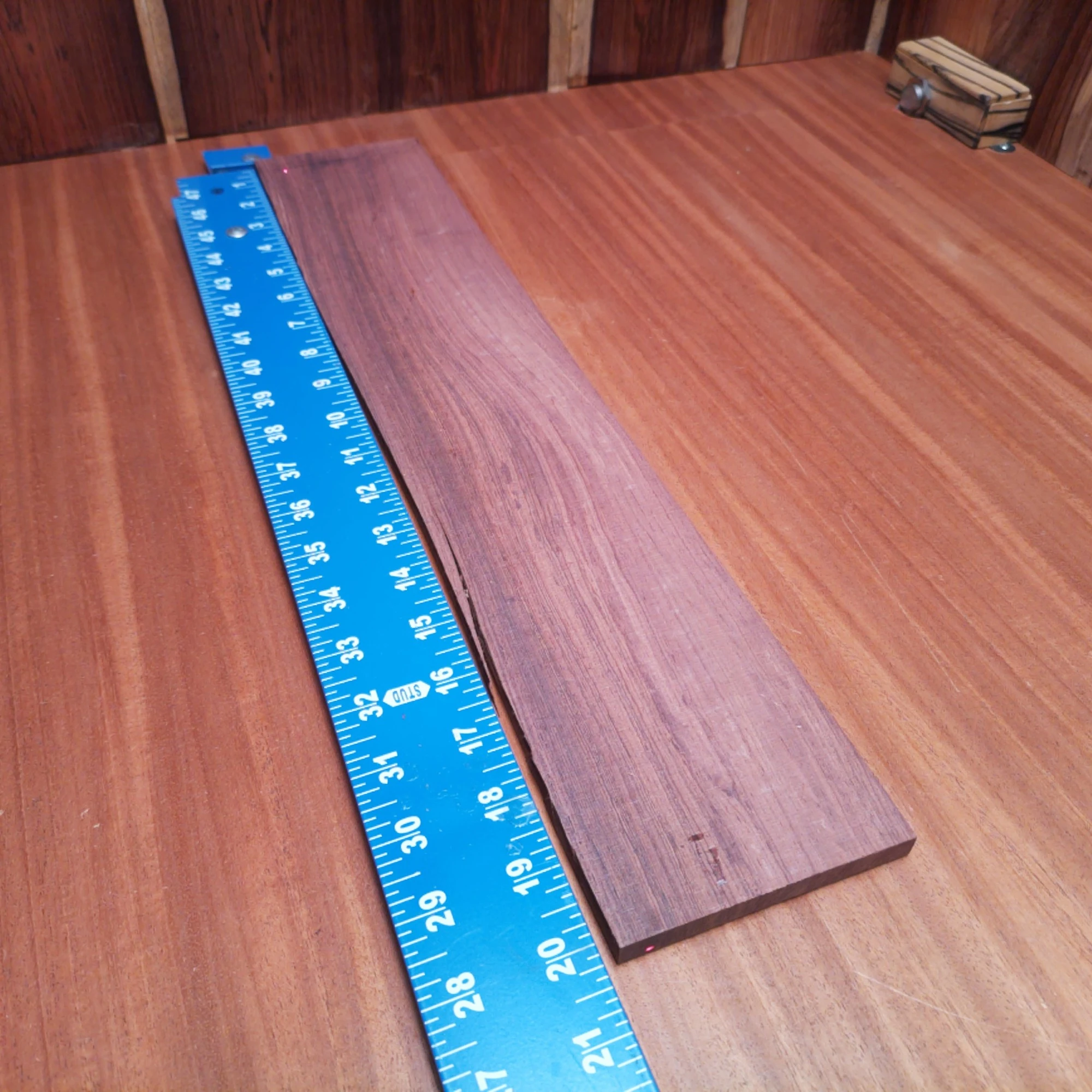 Honduran Rosewood Acoustic Rift Sawn Fingerboard Blank 0.4" X 3.9" X 20.1" - HRAFBR000188 2 Crafted from stunning Honduran Rosewood, this fingerboards blank offers a smooth surface perfect for your stringed creations. Its rift-sawn cut enhances tonal clarity, making it a top choice for professional luthiers. Whether you're building a new acoustic masterpiece or need a reliable blank for repairs, this premium material stands up to the challenge. Discover the perfect blend of beauty, durability, and tonal excellence today! It is a Honduran Rosewood Acoustic Rift Sawn fingerboard blank with dimensions of 20.1 x 3.9 x 0.4 inches.