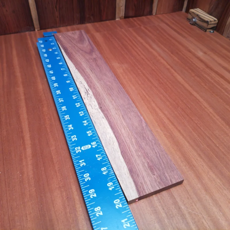 This Honduran Rosewood blank is the perfect choice for luthiers looking to create stunning acoustic instruments. Its rift sawn cut ensures consistent grain patterns, adding both beauty and durability to your projects. This high-quality wood is known for its resonant tonal properties, making it a sought-after material for guitars and other stringed instruments. Bring your craft to life with this vibrant and robust fingerboard blank! It is a Honduran Rosewood Acoustic Rift Sawn fingerboard blank with dimensions of 20.0 x 3.4 x 0.4 inches.
