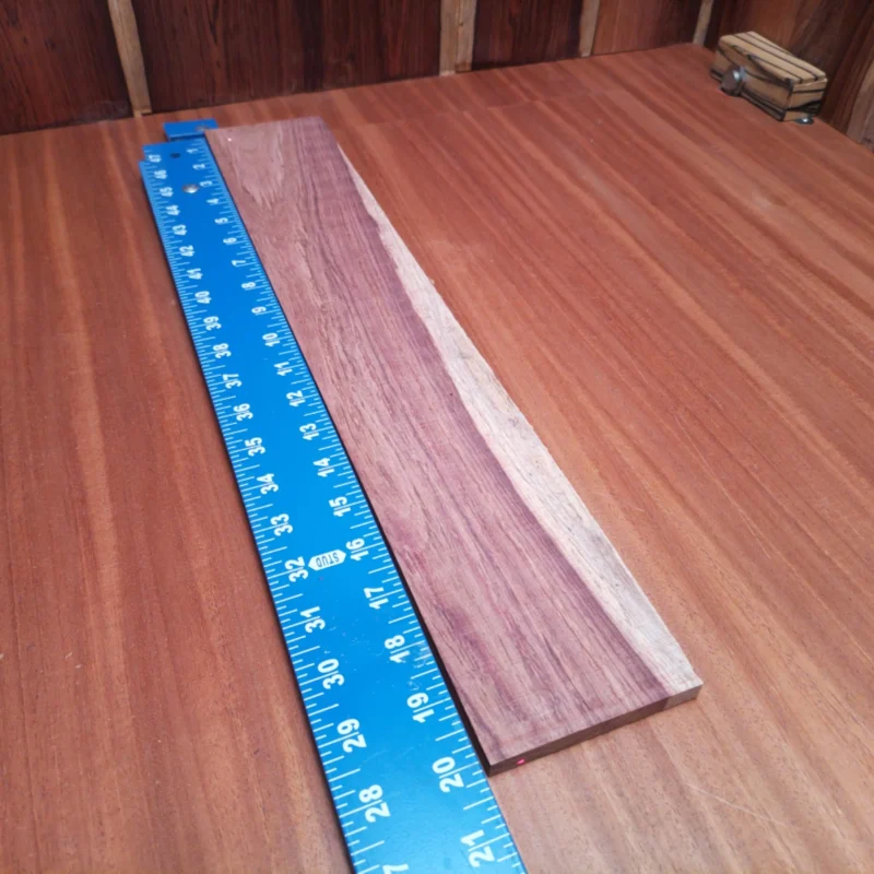 Honduran Rosewood Acoustic Rift Sawn Fingerboard Blank 0.4" X 3.4" X 20.0" - HRAFBR000190 3 This Honduran Rosewood blank is the perfect choice for luthiers looking to create stunning acoustic instruments. Its rift sawn cut ensures consistent grain patterns, adding both beauty and durability to your projects. This high-quality wood is known for its resonant tonal properties, making it a sought-after material for guitars and other stringed instruments. Bring your craft to life with this vibrant and robust fingerboard blank! It is a Honduran Rosewood Acoustic Rift Sawn fingerboard blank with dimensions of 20.0 x 3.4 x 0.4 inches.