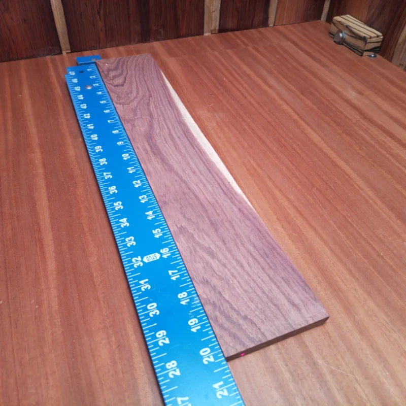 Honduran Rosewood Acoustic Rift Sawn Fingerboard Blank 0.4" X 3.6" X 20.2" - HRAFBR000193 3 Crafted from genuine Honduran Rosewood, this fingerboards blank offers rich tonal qualities and stunning aesthetics. Its rift-sawn design delivers consistent grain and durability for luthiers looking to create hand-crafted acoustic masterpieces. This material not only looks great but also enhances playability, making it ideal for innovative guitar builds. Perfect for both novice and seasoned builders, this fingerboard blank promises to inspire your next musical creation! It is a Honduran Rosewood Acoustic Rift Sawn fingerboard blank with dimensions of 20.2 x 3.6 x 0.4 inches.