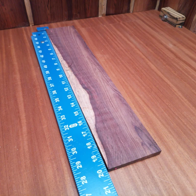 Crafted from premium Honduran Rosewood, this fingerboard blank offers a rich tonal quality that elevates any acoustic instrument. Perfect for luthiers, its beautiful grain and solid durability promise both aesthetic appeal and longevity. Shape, sand, and finish to your liking—this is the ideal canvas for your next masterpiece! Unlock your creativity and let this stunning piece enhance your builds with ease. It is a Honduran Rosewood Acoustic Rift Sawn fingerboard blank with dimensions of 20.0 x 3.7 x 0.4 inches.