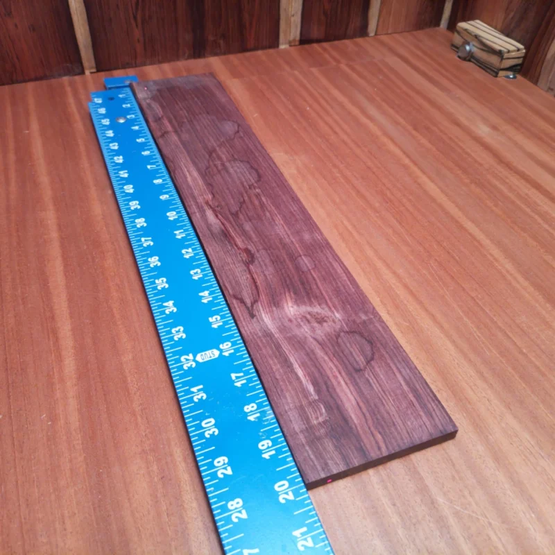 Unlock your creativity with this Honduran Rosewood acoustic blank! Perfect for luthiers seeking rich tones and stunning aesthetics. Its rift sawn cut ensures durability and stability, making it a reliable choice for your next project. With a warm, deep sound and unique grain patterns, this fingerboard blank will elevate your instruments to the next level of craftsmanship. It is a Honduran Rosewood Acoustic Rift Sawn fingerboard blank with dimensions of 20.1 x 3.9 x 0.4 inches.