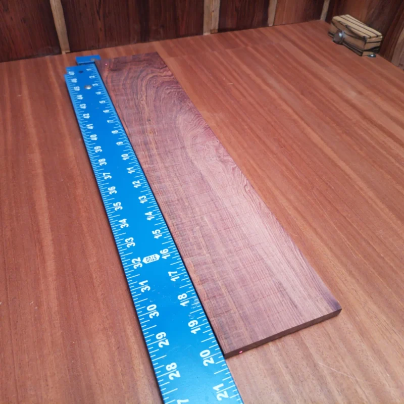 Fingerboard Blanks 72 Elevate your craftsmanship with this Honduran Rosewood fingerboards blank. Perfect for luthiers looking for premium quality, its rich, warm tones enhance sound clarity and resonance. Boasting a striking grain pattern, this blank isn't just a practical choice; it also adds visual appeal to your instruments. Ideal for creating top-notch acoustic guitars, your creations will resonate with unmatched beauty and depth. It is a Honduran Rosewood Acoustic Rift Sawn fingerboard blank with dimensions of 20.1 x 4.0 x 0.3 inches.