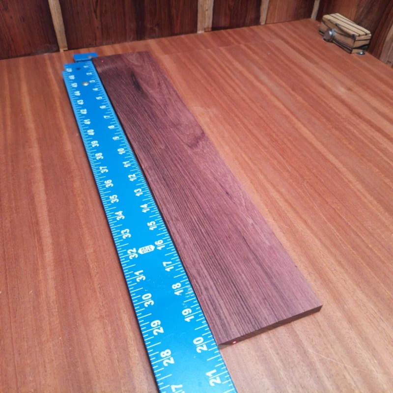 Elevate your luthier skills with this Honduran Rosewood blank, perfect for crafting stunning acoustic instruments. Its rich grain and vibrant tone make it a favorite among builders, while the unique rift sawn cuts offer unmatched stability. Whether you're designing a custom guitar or a beautiful ukulele, this incredible wood is your go-to for quality and performance in every strum! It is a Honduran Rosewood Acoustic Rift Sawn fingerboard blank with dimensions of 20.1 x 3.7 x 0.4 inches.