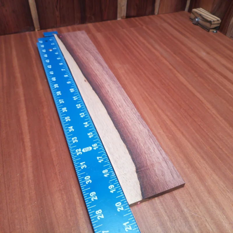 Unlock your creative potential with this premium Honduran Rosewood blank, perfect for luthiers. Its rich tonal qualities offer a warm, resonant sound that will elevate any acoustic instrument. With striking grain patterns, this wood not only performs beautifully but also looks stunning in all your creations. Get ready to craft a masterpiece that sounds as great as it looks! It is a Honduran Rosewood Acoustic Rift Sawn fingerboard blank with dimensions of 20.0 x 3.3 x 0.4 inches.