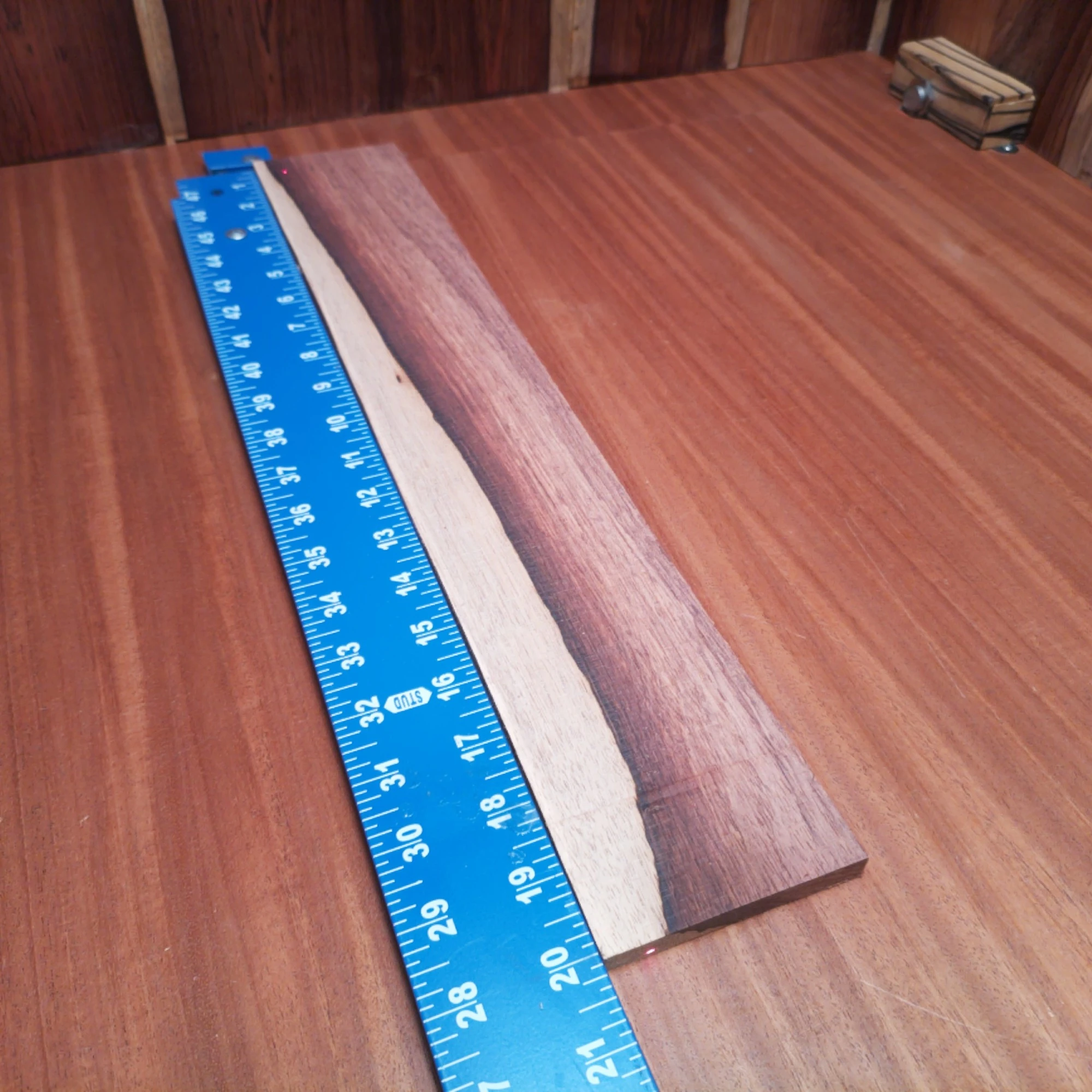 Honduran Rosewood Acoustic Rift Sawn Fingerboard Blank 0.4" X 3.3" X 20.0" - HRAFBR000202 1 Unlock your creative potential with this premium Honduran Rosewood blank, perfect for luthiers. Its rich tonal qualities offer a warm, resonant sound that will elevate any acoustic instrument. With striking grain patterns, this wood not only performs beautifully but also looks stunning in all your creations. Get ready to craft a masterpiece that sounds as great as it looks! It is a Honduran Rosewood Acoustic Rift Sawn fingerboard blank with dimensions of 20.0 x 3.3 x 0.4 inches.