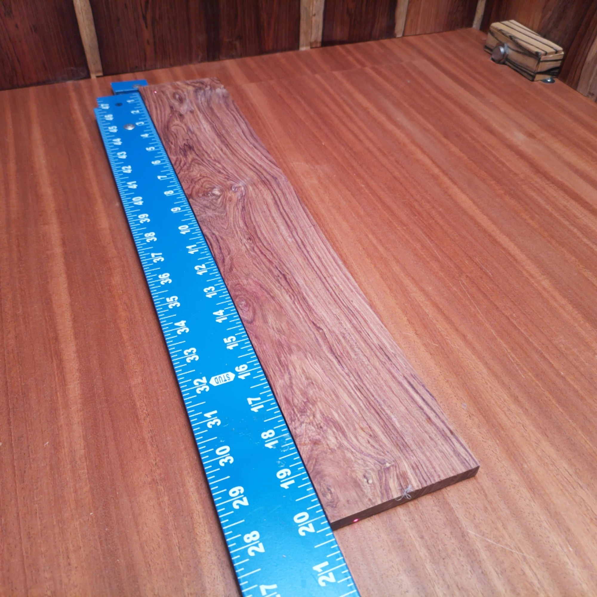 Honduran Rosewood Acoustic Rift Sawn Fingerboard Blank 0.3" X 3.4" X 20.1" - HRAFBR000208 1 Elevate your craft with this Honduran rosewood fingerboard blank. Perfect for luthiers, its rift sawn design ensures stability and excellent tonal clarity. With rich, warm tones and a beautiful grain pattern, this fingerboard will enhance any acoustic instrument. Ideal for both novice and seasoned builders, this blank is a must-have for your workshop essentials. Get ready to create music that resonates with elegance and character! It is a Honduran Rosewood Acoustic Rift Sawn fingerboard blank with dimensions of 20.1 x 3.4 x 0.3 inches.