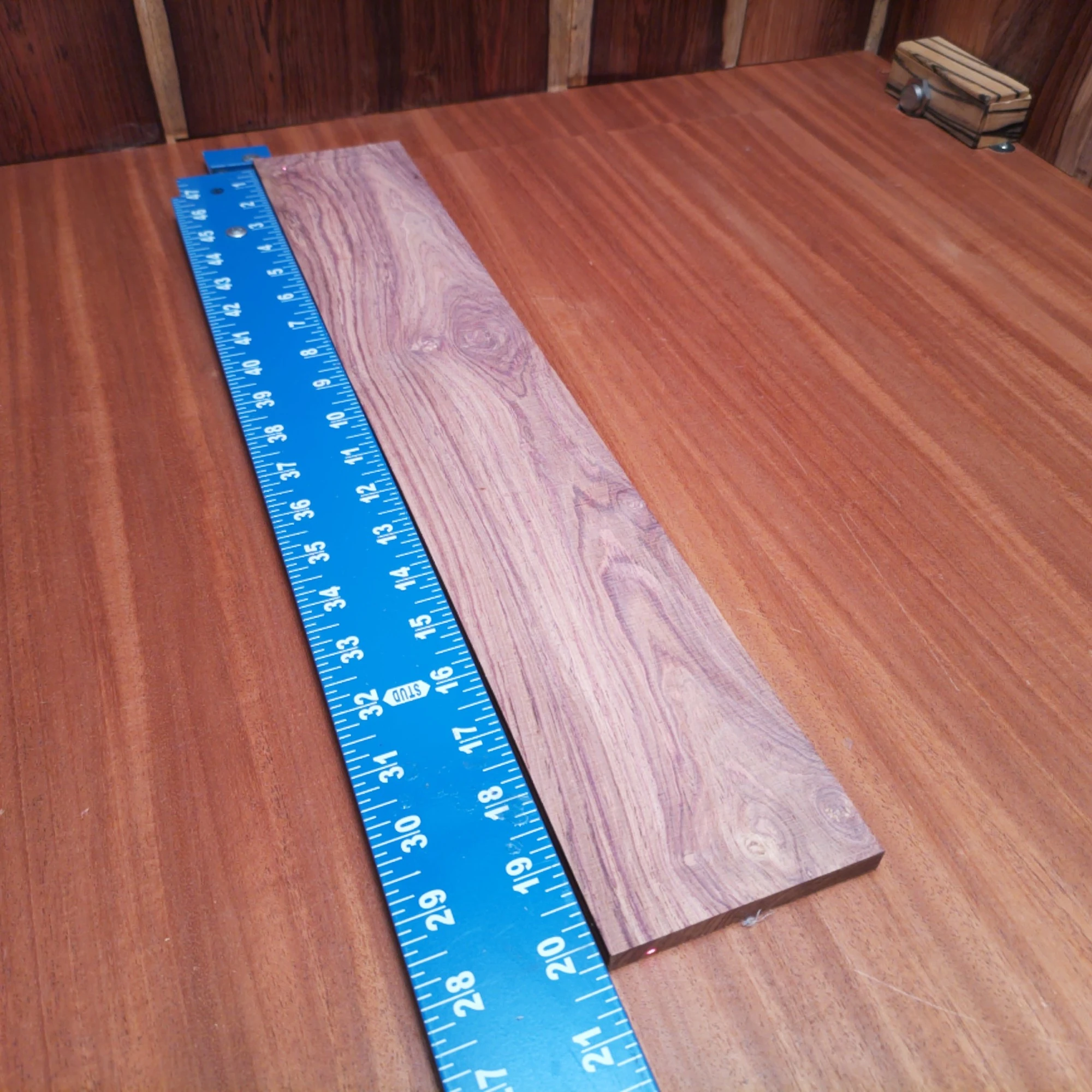 Honduran Rosewood Acoustic Rift Sawn Fingerboard Blank 0.3" X 3.4" X 20.1" - HRAFBR000208 2 Elevate your craft with this Honduran rosewood fingerboard blank. Perfect for luthiers, its rift sawn design ensures stability and excellent tonal clarity. With rich, warm tones and a beautiful grain pattern, this fingerboard will enhance any acoustic instrument. Ideal for both novice and seasoned builders, this blank is a must-have for your workshop essentials. Get ready to create music that resonates with elegance and character! It is a Honduran Rosewood Acoustic Rift Sawn fingerboard blank with dimensions of 20.1 x 3.4 x 0.3 inches.