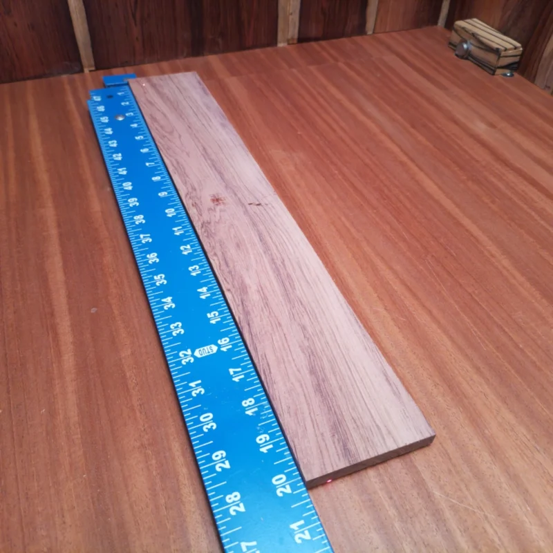 Honduran Rosewood Acoustic Rift Sawn Fingerboard Blank 0.4" X 3.2" X 20.1" - HRAFBR000209 3 Crafted from premium Honduran rosewood, this acoustic fingerboard blank in rift sawn is perfect for luthiers seeking to create stunning instruments. With its rich color and remarkable tonal characteristics, this blank delivers both beauty and sound quality. Ideal for your next project, this fingerboard will elevate your craft and result in an impressive finish that musicians will love! It is a Honduran Rosewood Acoustic Rift Sawn fingerboard blank with dimensions of 20.1 x 3.2 x 0.4 inches.