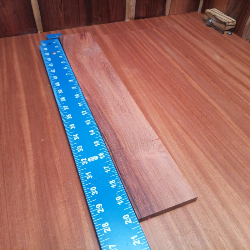 Elevate your guitar builds with this Honduran Rosewood fingerboard blank, perfect for crafting premium acoustic instruments. Its rift sawn cut showcases stunning grain patterns, providing both durability and aesthetic appeal. Whether you're a seasoned luthier or just starting, this fingerboard blank will enhance your creations, making every strum a delight. It is a Honduran Rosewood Acoustic Rift Sawn fingerboard blank with dimensions of 20.1 x 3.2 x 0.4 inches.