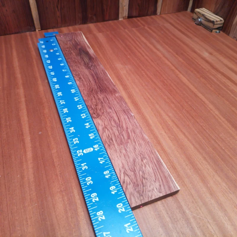Fingerboard Blanks 151 Unlock your creative potential with this premium Honduras Rosewood blank, perfect for luthiers crafting acoustic masterpieces. Its impressive dark, rich grains enhance the aesthetic appeal while providing outstanding tonal qualities. This fingerboards blank is ideal for enhancing playability and sound, ensuring your instruments stand out. Get ready to transform your designs into professional-grade acoustic guitars with ease! It is a Honduran Rosewood Acoustic Rift Sawn fingerboard blank with dimensions of 20.1 x 2.8 x 0.4 inches.