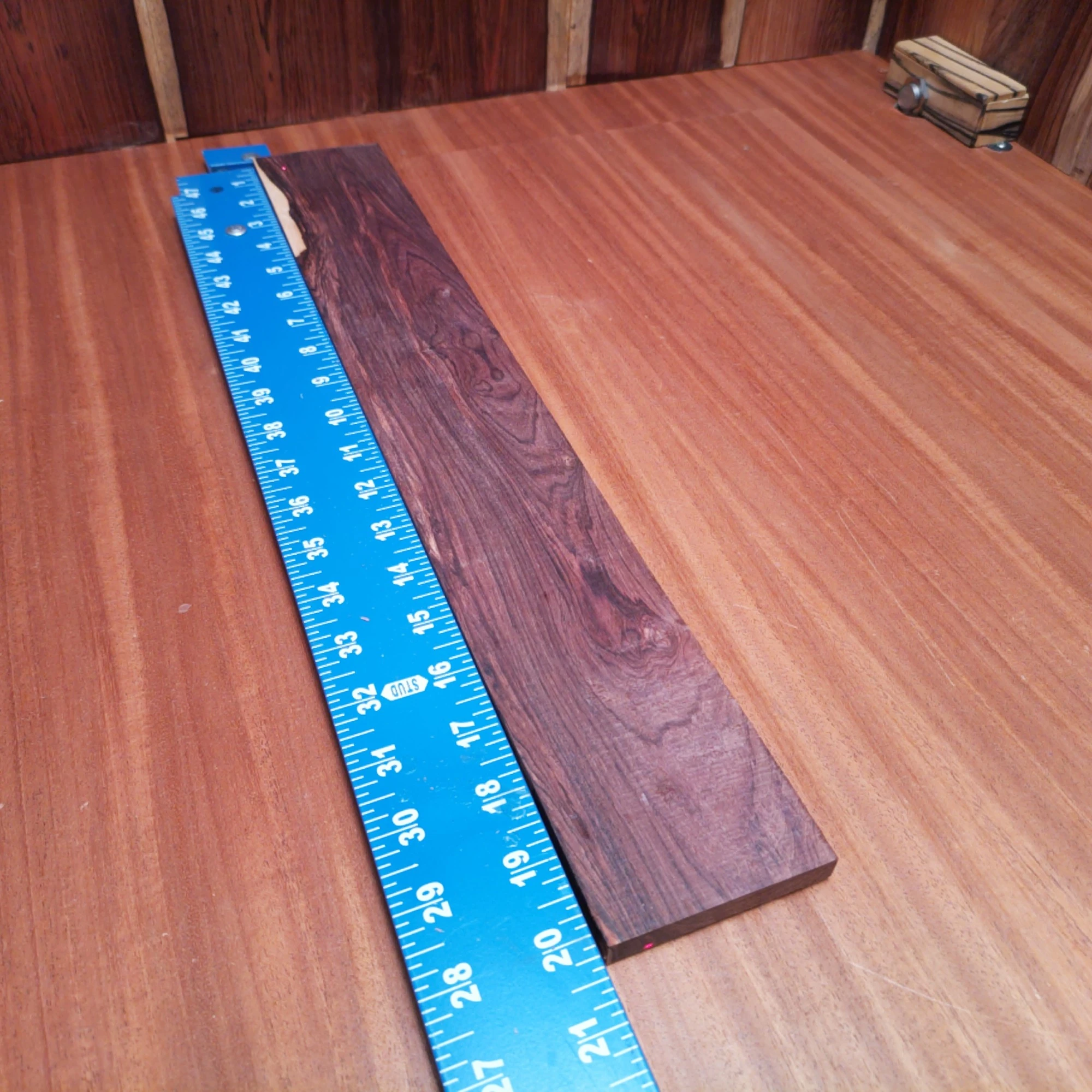 Honduran Rosewood Acoustic Rift Sawn Fingerboard Blank 0.4" X 2.9" X 20.2" - HRAFBR000222 1 Craft your next acoustic masterpiece with this stunning Honduran Rosewood fingerboard blank. The rich colors and unique grain patterns make it a favorite among luthiers. Perfect for adding warmth and depth to your guitar's tone, this durable wood offers exceptional playability. Whether you're a seasoned pro or a budding luthier, this fingerboard blank is the ideal canvas for your creativity, transforming your instrument into a true work of art. It is a Honduran Rosewood Acoustic Rift Sawn fingerboard blank with dimensions of 20.2 x 2.9 x 0.4 inches.