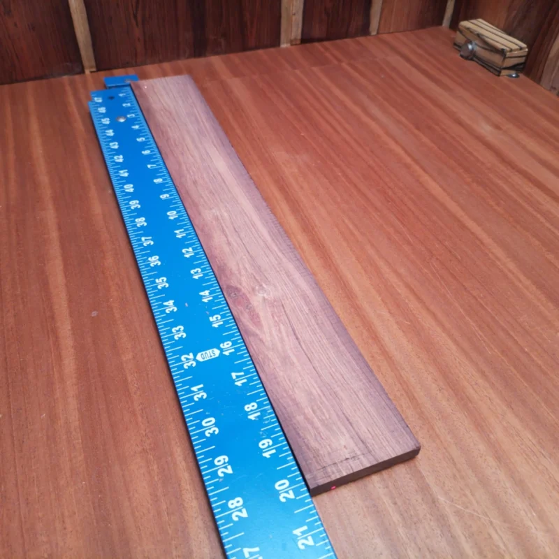 Honduran Rosewood Acoustic Rift Sawn Fingerboard Blank 0.4" X 2.7" X 20.1" - HRAFBR000225 3 Craft your next masterpiece with this Honduran Rosewood blank. Its rich acoustic properties ensure a resonant sound, making it a favorite among luthiers. With a striking rift-sawn grain, this blank not only enhances your instrument's aesthetics but also delivers clarity and warmth. Whether you're building for performance or passion, this quality wood is essential for any serious builder. It is a Honduran Rosewood Acoustic Rift Sawn fingerboard blank with dimensions of 20.1 x 2.7 x 0.4 inches.