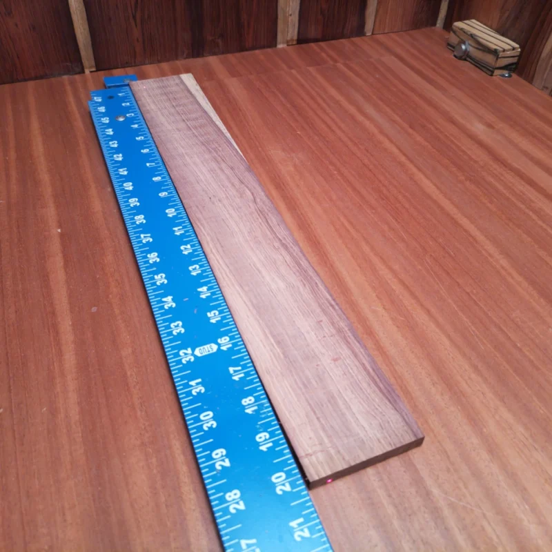 Unlock your creativity with this Honduran Rosewood fingerboards blank, perfect for luthiers seeking material that combines beauty and durability. Its rich grain and deep color will elevate any acoustic project, ensuring a stunning finish that impresses. This blank is easy to shape and carve, making it an excellent choice for fine craftsmanship in your builds. Transform your vision into reality with this premium wood selection, perfect for crafting exquisite fingerboards. It is a Honduran Rosewood Acoustic Rift Sawn fingerboard blank with dimensions of 20.1 x 2.9 x 0.4 inches.