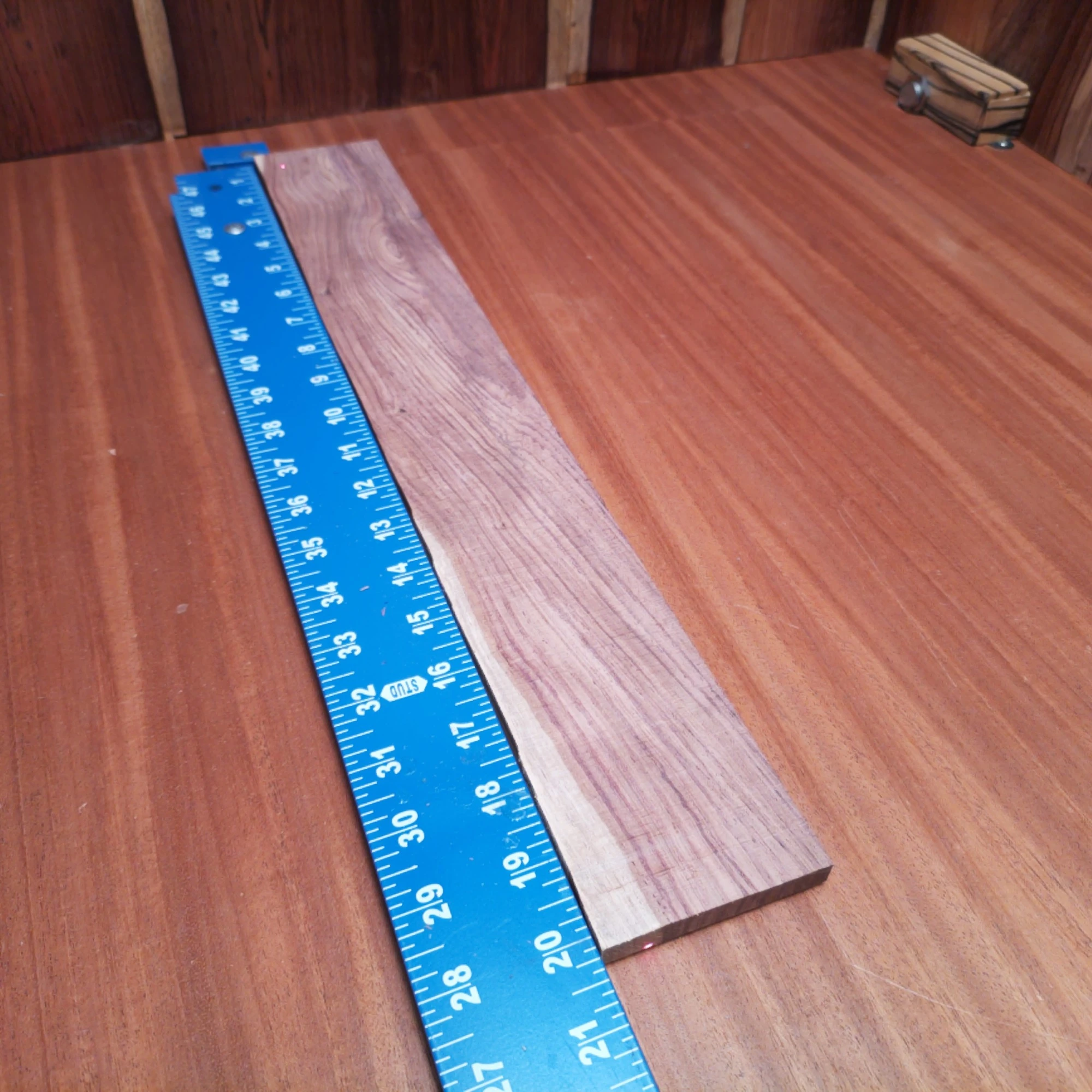 Honduran Rosewood Acoustic Rift Sawn Fingerboard Blank 0.4" X 2.9" X 20.2" - HRAFBR000231 1 Crafted from the finest Honduran Rosewood, this acoustic fingerboard blank offers superb tonal qualities and stunning aesthetics. Perfect for luthiers seeking to create striking instruments with rich bass and bright highs. Whether shaping, sanding, or finishing, this blank promises to elevate your guitar's performance and look. Get ready to impress players and audiences alike with your craftsmanship using this premium wood! It is a Honduran Rosewood Acoustic Rift Sawn fingerboard blank with dimensions of 20.2 x 2.9 x 0.4 inches.