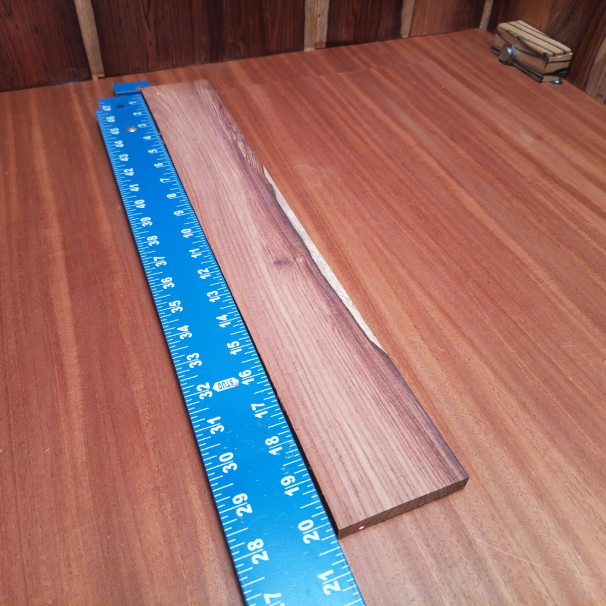 Honduran Rosewood Acoustic Rift Sawn Fingerboard Blank 0.4" X 2.8" X 20.1" - HRAFBR000235 1 Elevate your luthiery with this premium Honduran Rosewood blank. Crafted for acoustic instruments, its dense grain ensures rich sound and durability. This versatile wood is perfect for backs, sides, and more, bringing both beauty and unmatched performance to your creations. Whether you’re a seasoned pro or a home hobbyist, your next masterpiece awaits. It is a Honduran Rosewood Acoustic Rift Sawn fingerboard blank with dimensions of 20.1 x 2.8 x 0.4 inches.