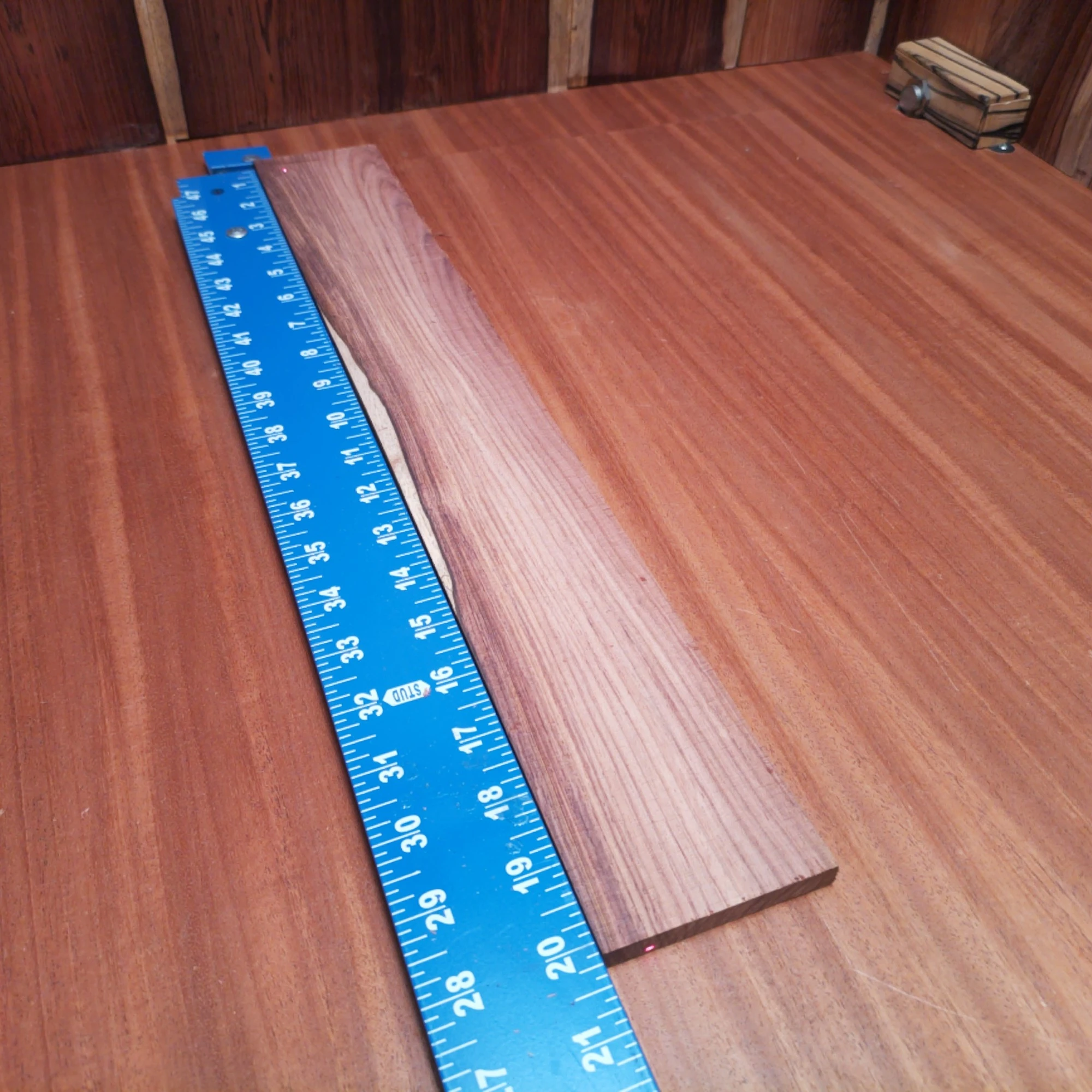 Honduran Rosewood Acoustic Rift Sawn Fingerboard Blank 0.4" X 2.8" X 20.1" - HRAFBR000235 2 Elevate your luthiery with this premium Honduran Rosewood blank. Crafted for acoustic instruments, its dense grain ensures rich sound and durability. This versatile wood is perfect for backs, sides, and more, bringing both beauty and unmatched performance to your creations. Whether you’re a seasoned pro or a home hobbyist, your next masterpiece awaits. It is a Honduran Rosewood Acoustic Rift Sawn fingerboard blank with dimensions of 20.1 x 2.8 x 0.4 inches.