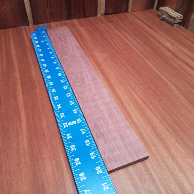 Honduran Rosewood Acoustic Rift Sawn Fingerboard Blank 0.4" X 2.9" X 20.2" - HRAFBR000236 3 Crafted for luthiers, this Honduran Rosewood blank boasts vibrant grain patterns, ideal for acoustic instruments. Its rift sawn design ensures unmatched stability, helping you create beautifully resonant guitars or ukuleles. Elevate your craftsmanship with this durable and rich-toned wood that enhances projection and tonal richness. Perfect for all skill levels, whether you're building your first guitar or a professional-grade instrument. It is a Honduran Rosewood Acoustic Rift Sawn fingerboard blank with dimensions of 20.2 x 2.9 x 0.4 inches.