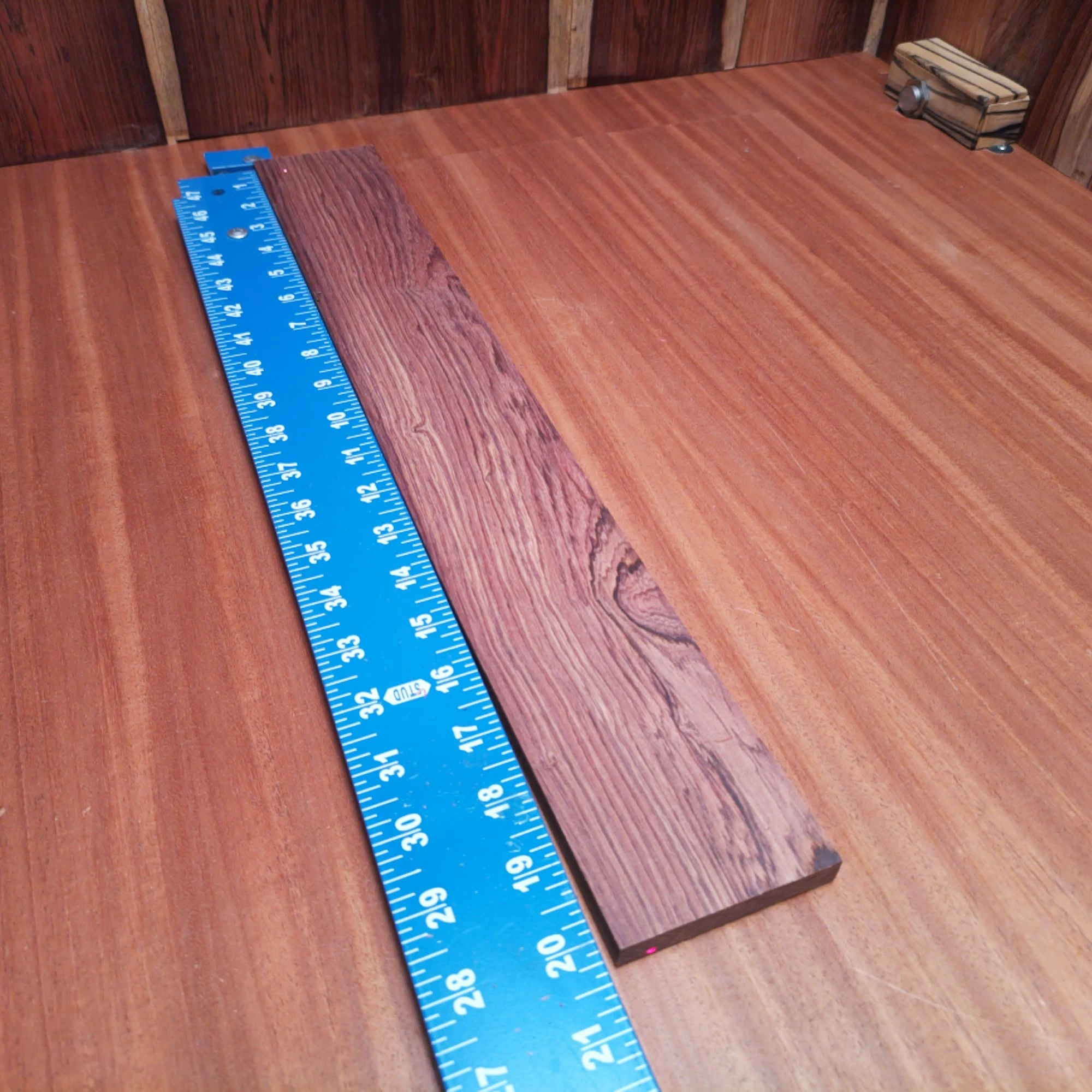 Honduran Rosewood Acoustic Rift Sawn Fingerboard Blank 0.4" X 2.8" X 20.1" - HRAFBR000237 1 Crafted from premium Honduran Rosewood, this fingerboard blank is perfect for luthiers seeking quality and versatility. With its rich tones and durable structure, it enhances any acoustic instrument. Ideal for custom builds, its smooth surface ensures easy handling and fine precision. Elevate your woodworking game with this premium materials that resonate with craftsmanship and innovation. It is a Honduran Rosewood Acoustic Rift Sawn fingerboard blank with dimensions of 20.1 x 2.8 x 0.4 inches.