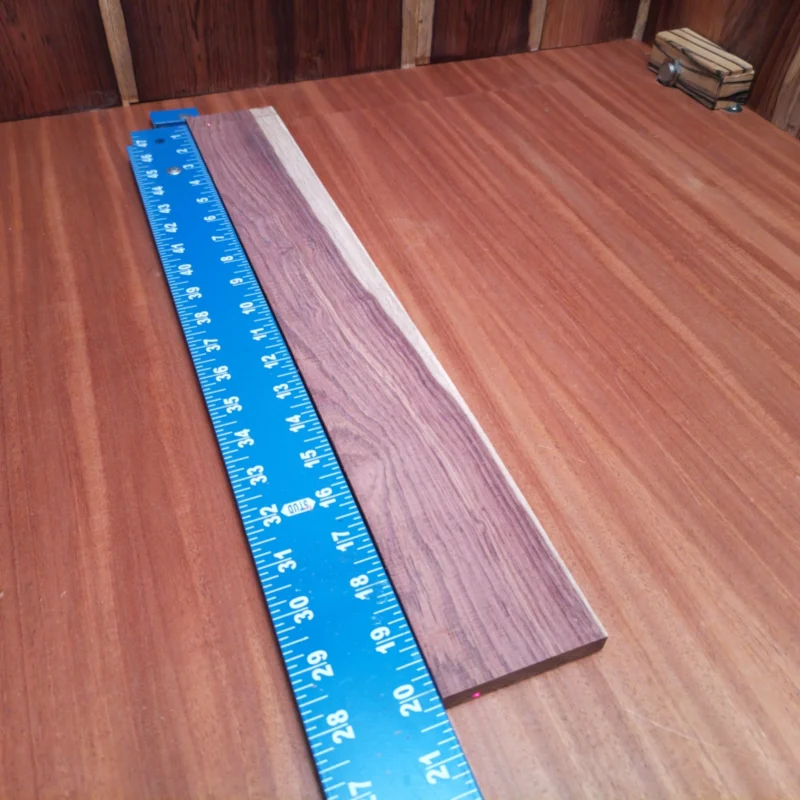 Honduran Rosewood Acoustic Rift Sawn Fingerboard Blank 0.4" X 2.8" X 20.1" - HRAFBR000237 3 Crafted from premium Honduran Rosewood, this fingerboard blank is perfect for luthiers seeking quality and versatility. With its rich tones and durable structure, it enhances any acoustic instrument. Ideal for custom builds, its smooth surface ensures easy handling and fine precision. Elevate your woodworking game with this premium materials that resonate with craftsmanship and innovation. It is a Honduran Rosewood Acoustic Rift Sawn fingerboard blank with dimensions of 20.1 x 2.8 x 0.4 inches.