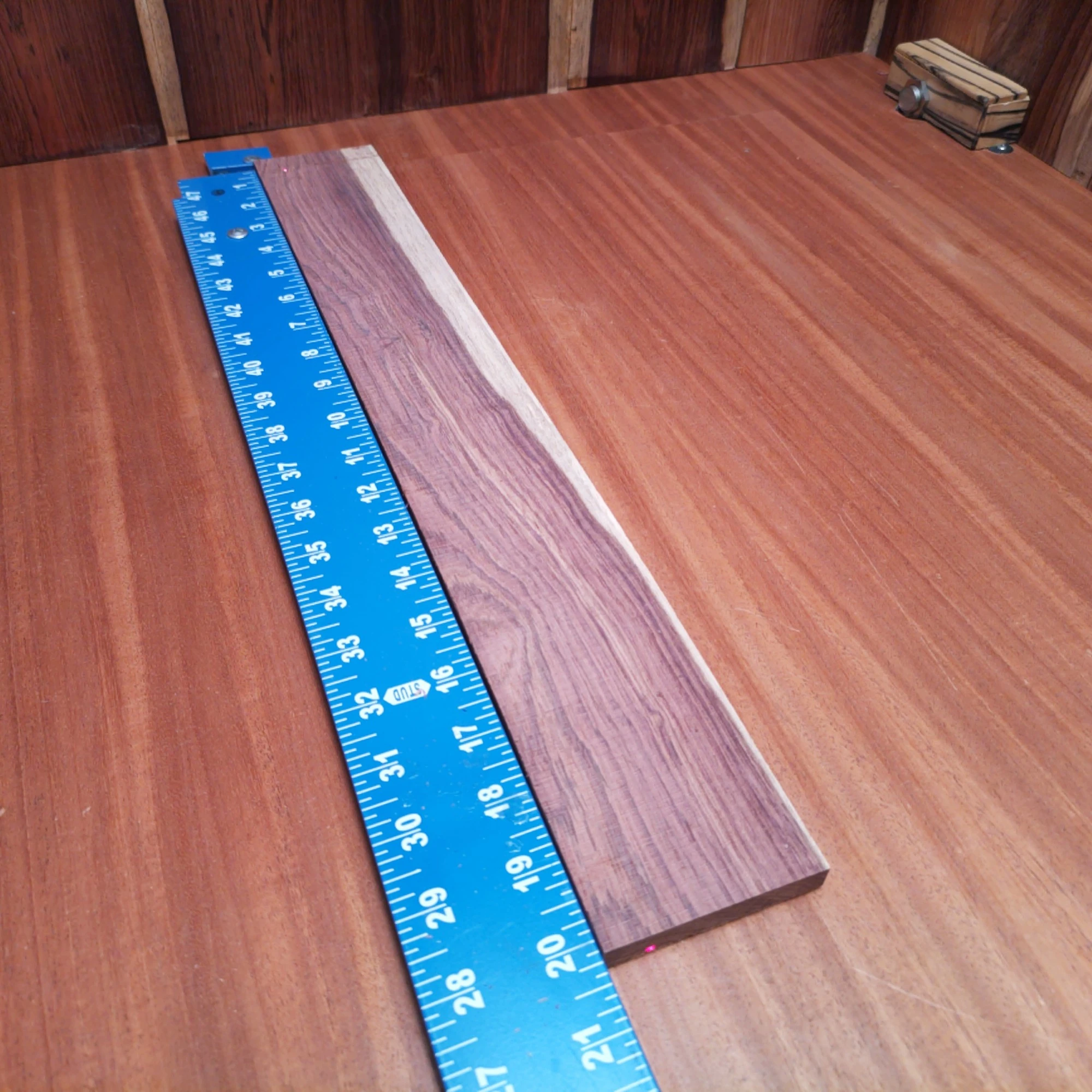 Honduran Rosewood Acoustic Rift Sawn Fingerboard Blank 0.4" X 2.8" X 20.1" - HRAFBR000237 2 Crafted from premium Honduran Rosewood, this fingerboard blank is perfect for luthiers seeking quality and versatility. With its rich tones and durable structure, it enhances any acoustic instrument. Ideal for custom builds, its smooth surface ensures easy handling and fine precision. Elevate your woodworking game with this premium materials that resonate with craftsmanship and innovation. It is a Honduran Rosewood Acoustic Rift Sawn fingerboard blank with dimensions of 20.1 x 2.8 x 0.4 inches.